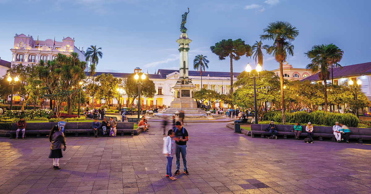 people milling around in plaza grande at twilight