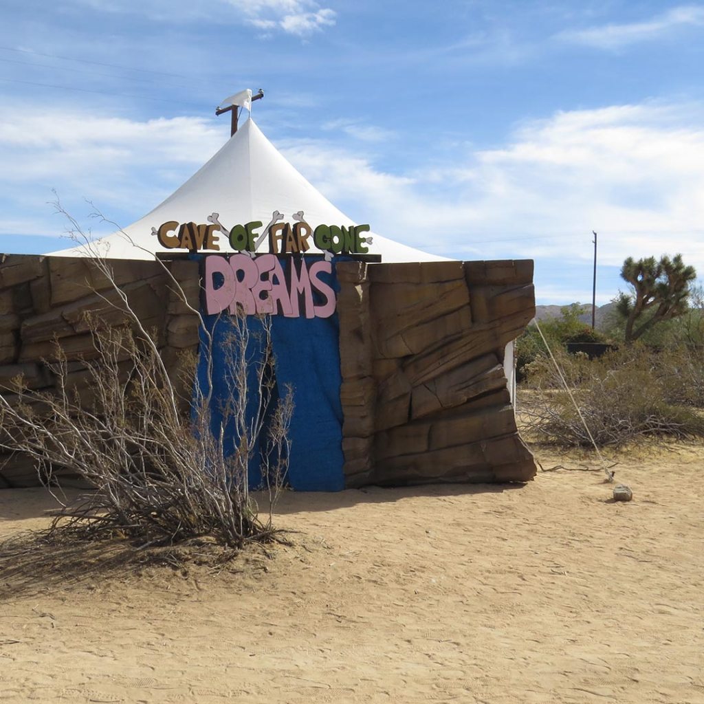 A tent with a sign reading Cave of Dreams