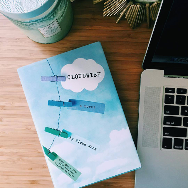 NOVL - Instagram image of book cover for 'Cloudwish' by Fiona Wood next to a laptop on a wooden table