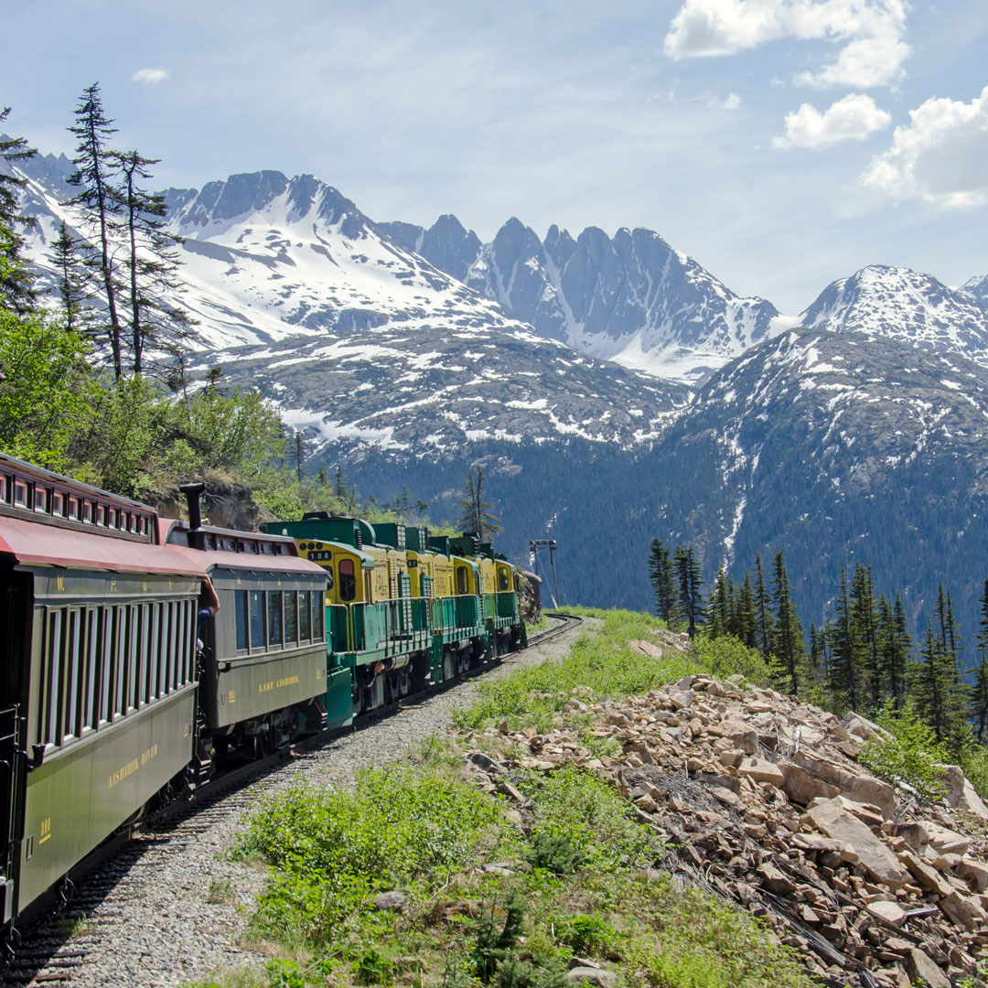 Train headed through Alaskan mountains