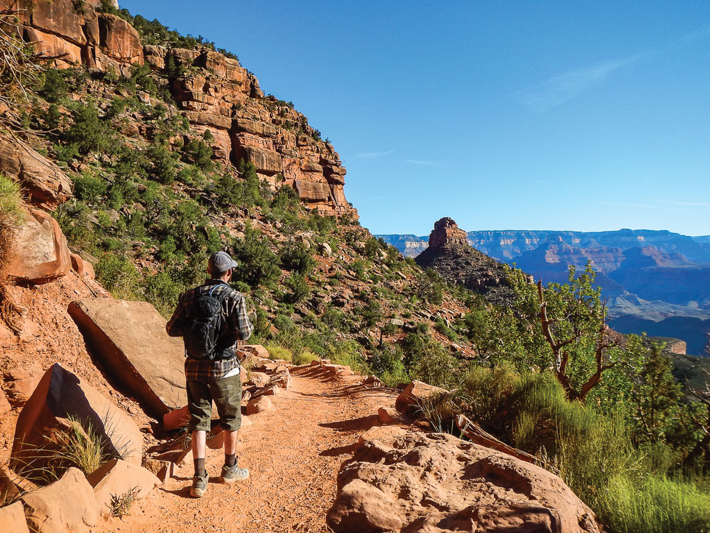 man walking along a trail in Arizona