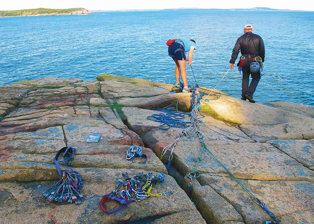 Climbers prepare to scale Acadia's granite cliffs