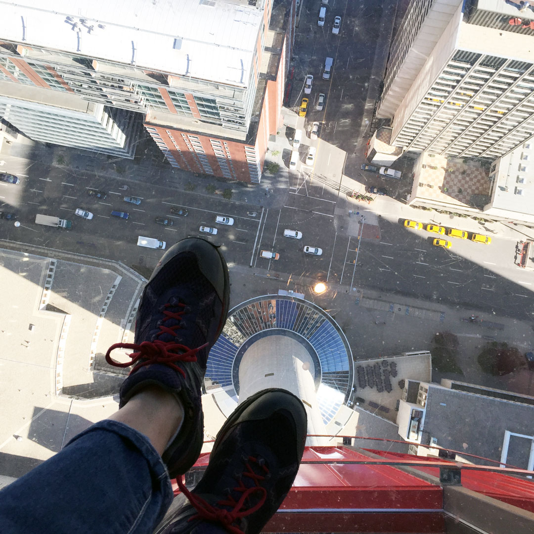 feet on a glass floor at Calgary Tower