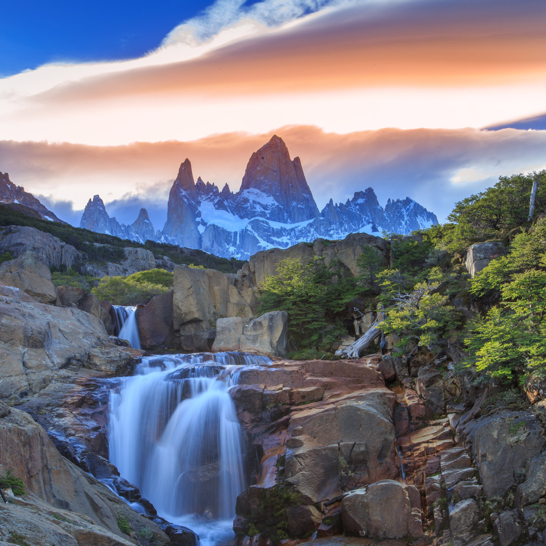 waterfalls on rocks with Mount Fitz Roy in the background of Argentinean Patagonia