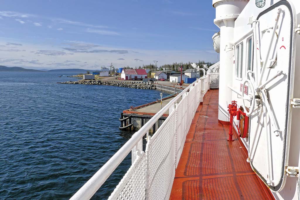 A coastal town viewed from the deck of the MV Northern Ranger.