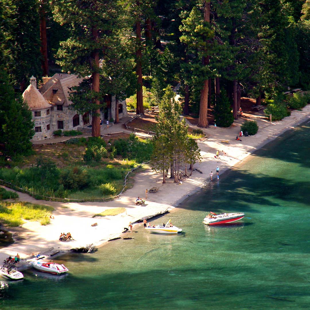 View of lakefront Vikingsholm and its beach.