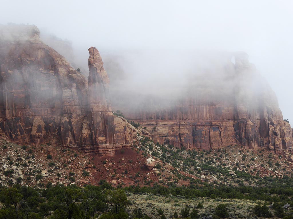 mist surrounding sandstone in Colorado National Monument