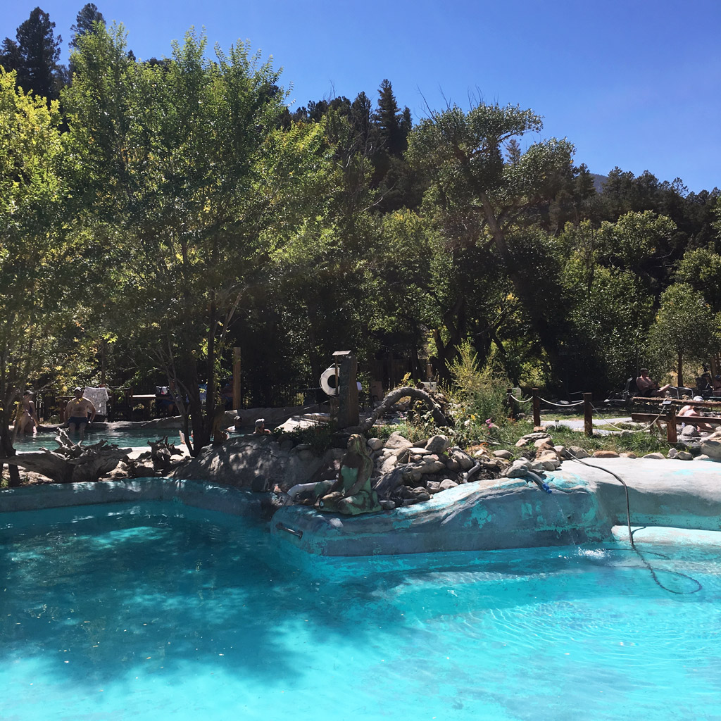 trees surround a pool in Colorado