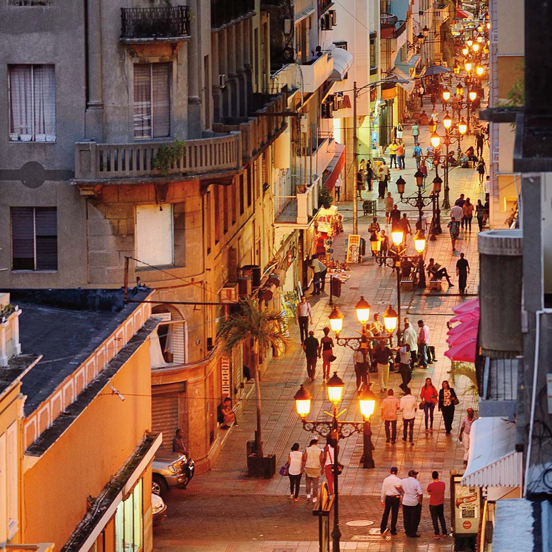 a street filled with people at dusk