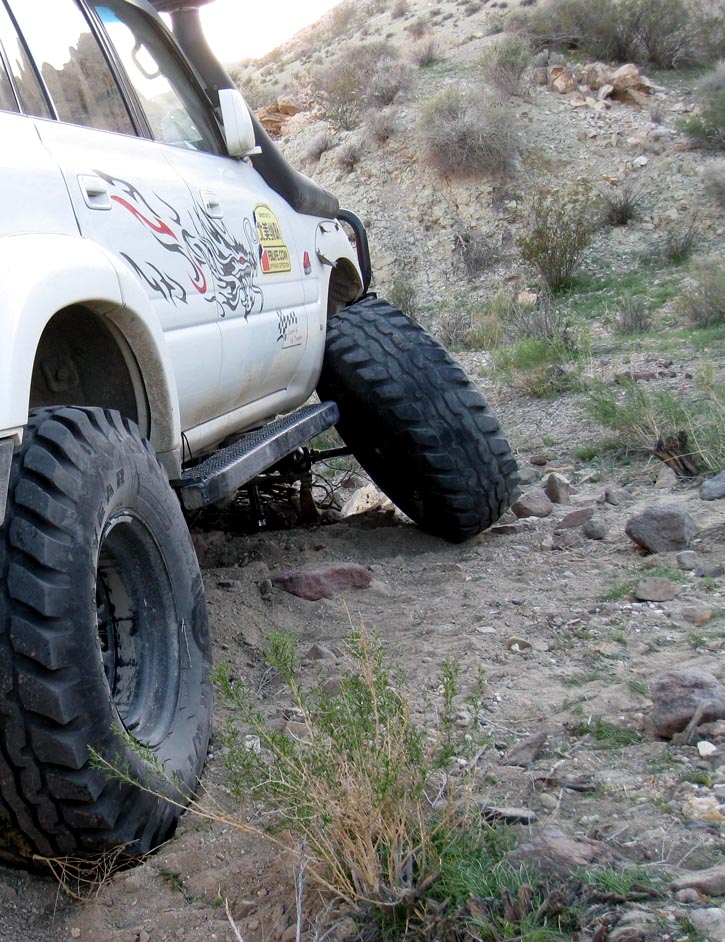 A temporarily abandoned Toyota Land Cruiser with missing (broken) front steering knuckle in a canyon above Panamint Valley.