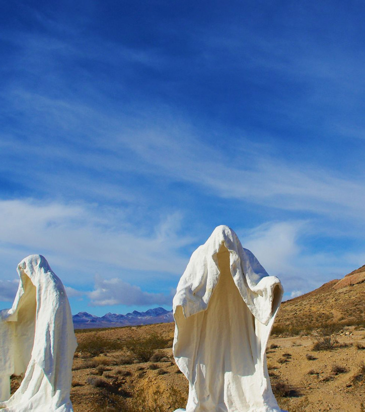 The art piece The Last Supper features ghostly life-size hollow figures against a desert background.