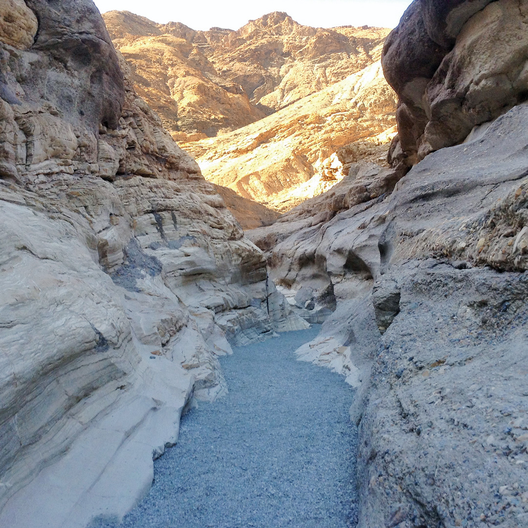 narrow pathway through rock canyons in Death Valley