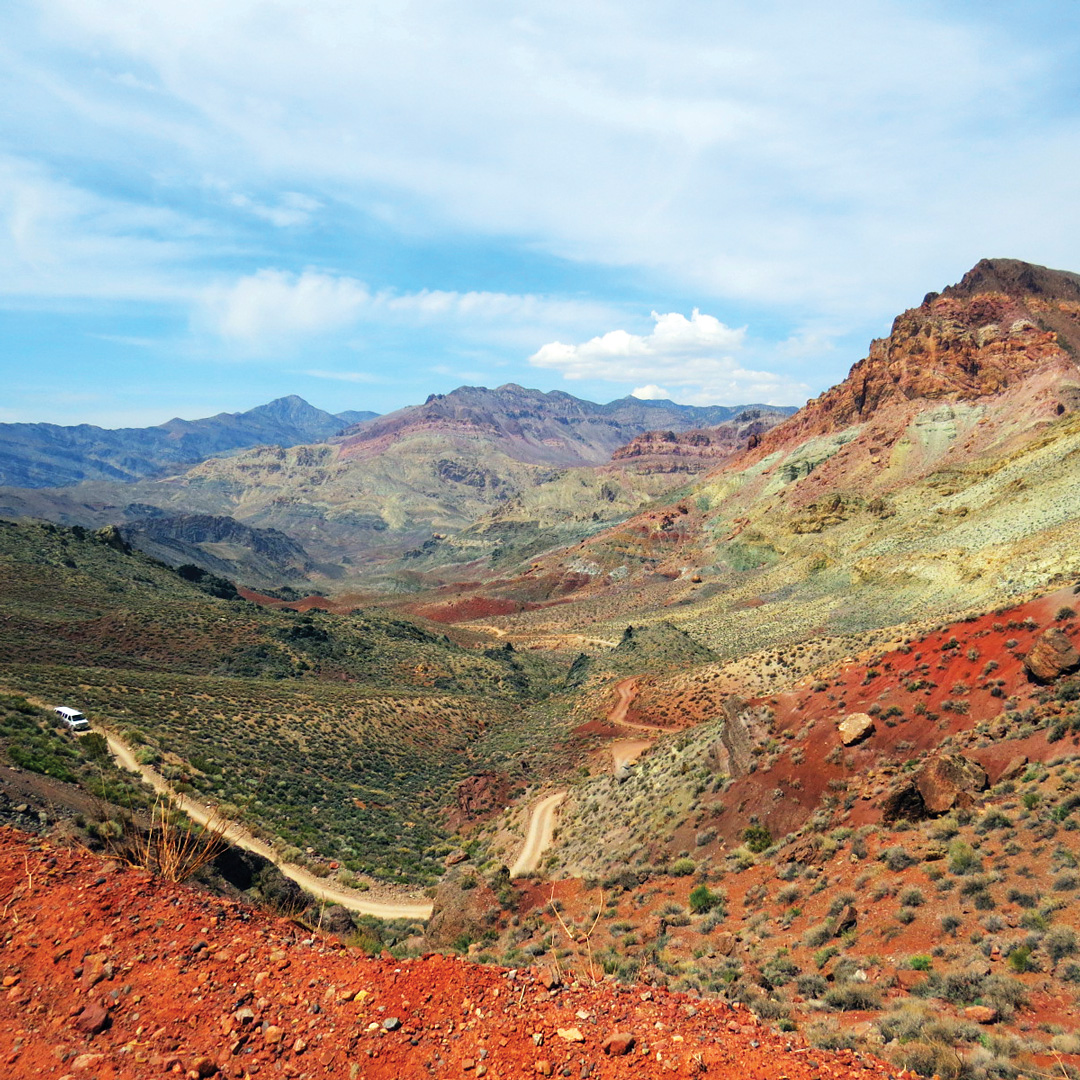 a dirt road winds through titus canyon in Death Valley