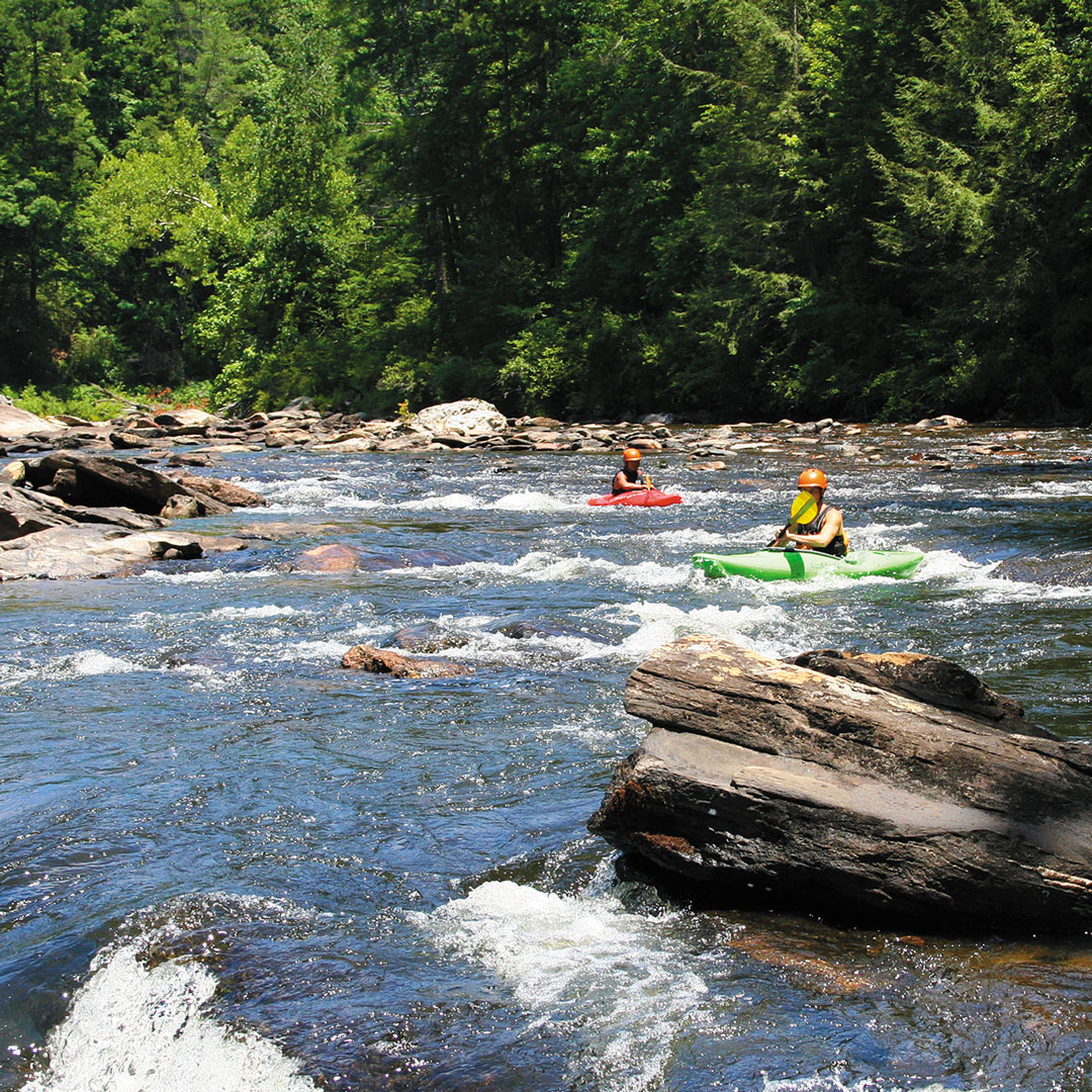 two people in canoes on the Chattooga River