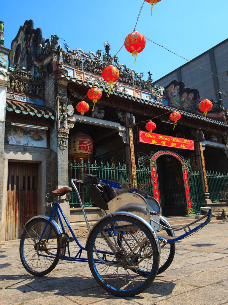xe om bike sits in front of the Thien Hau Pagoda in Ho Chi Minh City