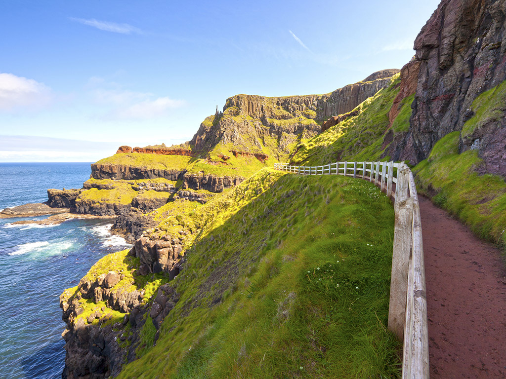 footpath winding along the coast of the ocean in Ireland near Giant's Causeway