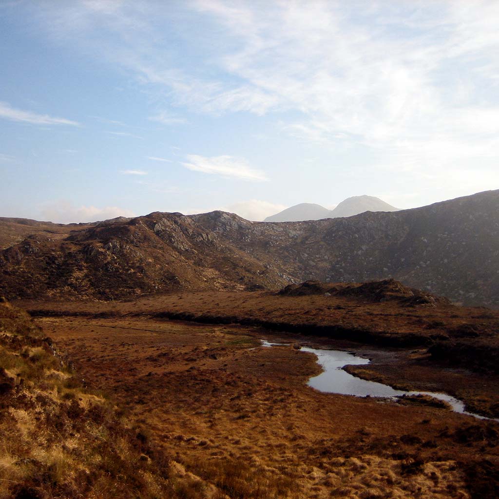 A river cuts through the valley in Ireland's Connemara National Park.
