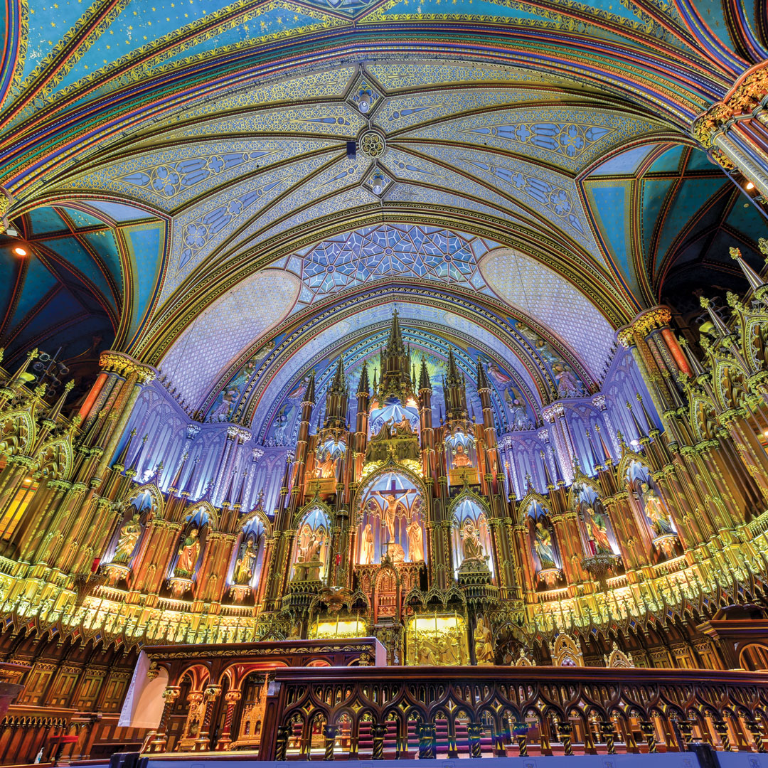 view of the colorful ceiling architecture inside the Notre Dame Basilica