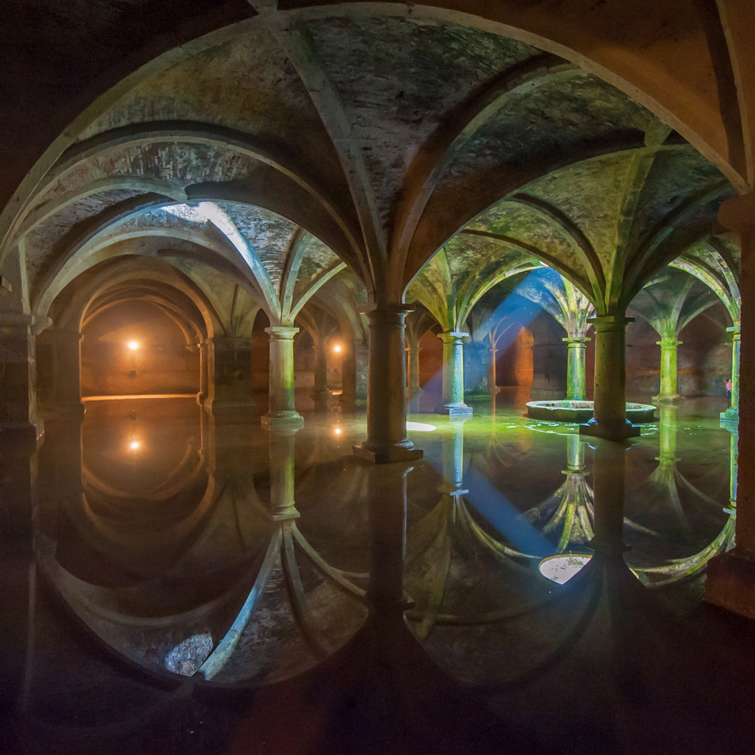 Portguese architecture reflected in the water of a cistern in Morocco