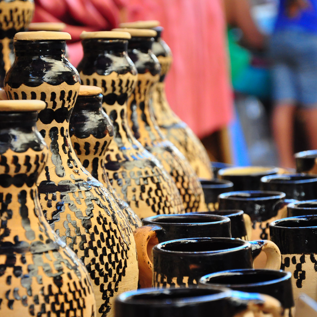hand painted pottery on display at a Moroccan market