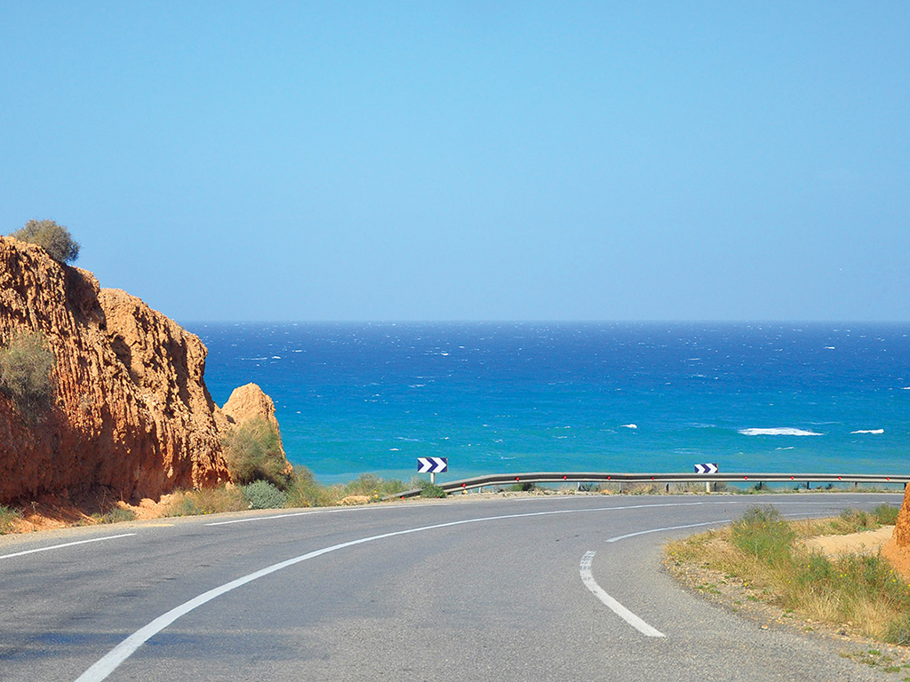 road curving along the coast of the Mediterranean in Morocco