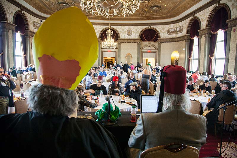 A Lovecraftian hierophant and deacon preside over NecronomiCon's Cthulhu Prayer Breakfast.