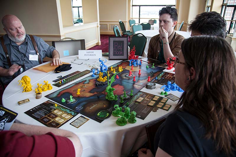 A group attendees playing the Cthulhu Wars board game.