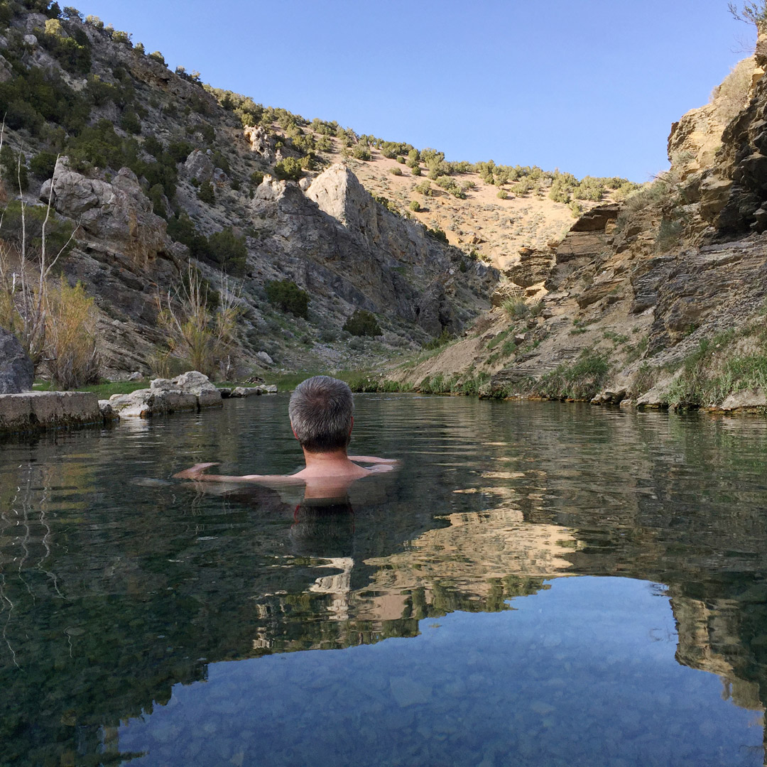 man soaking in a Nevada hot spring