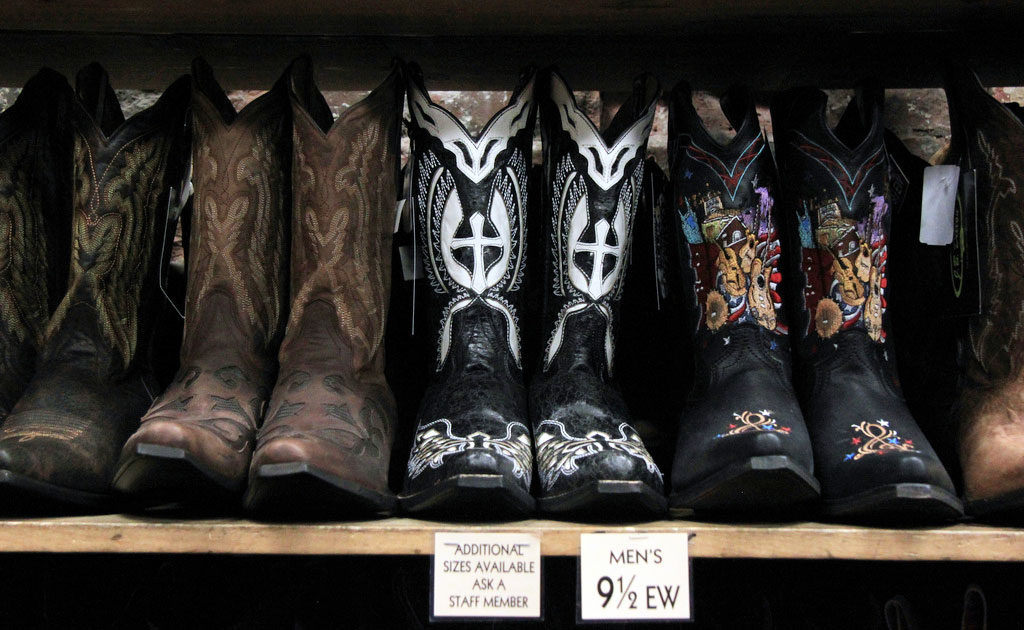 Row of elaborate boots on display in a boot store in Nashville.