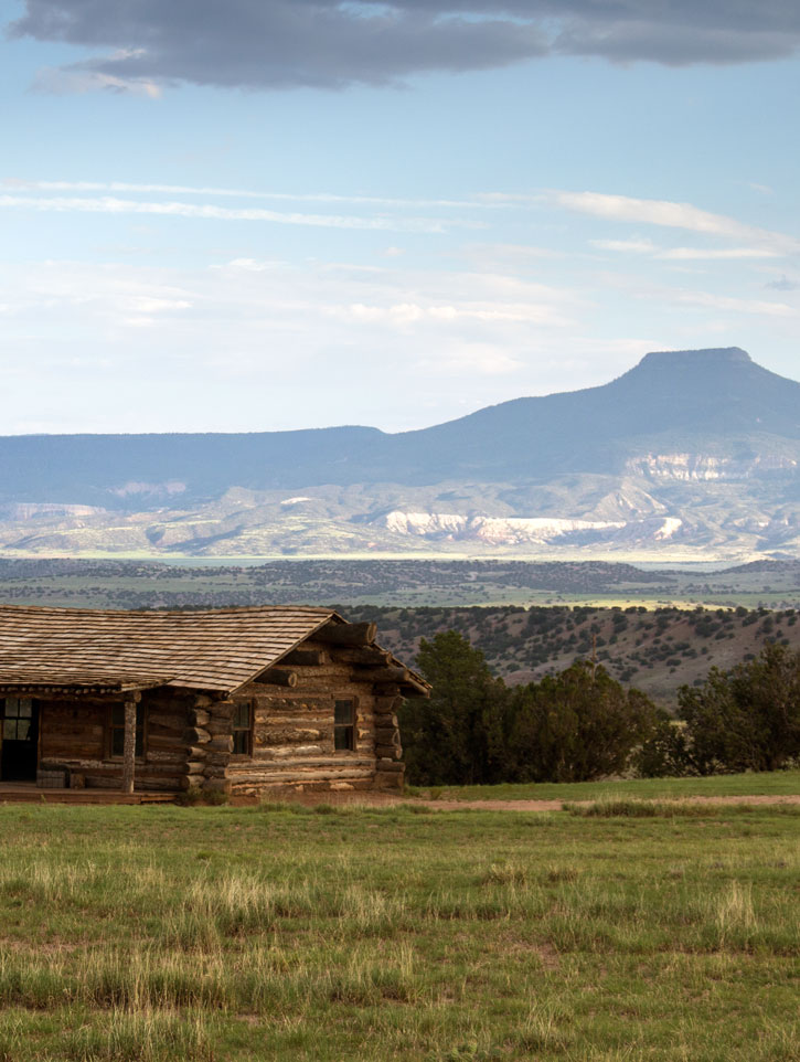 view of Pedernal Peak and cabin at Ghost Ranch.