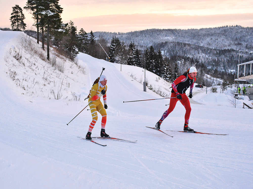 two cross-country skiers on a snow-covered mountain in Norway