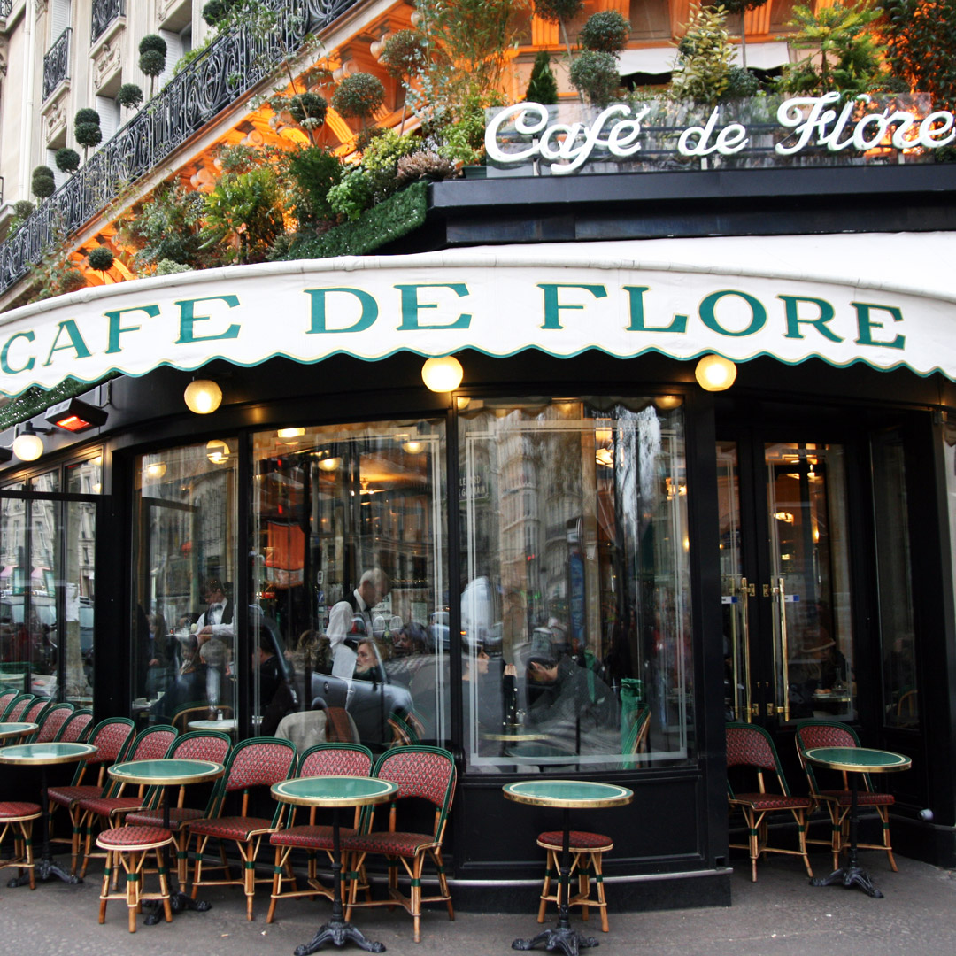 tables sit outside Cafe de Flore in Paris