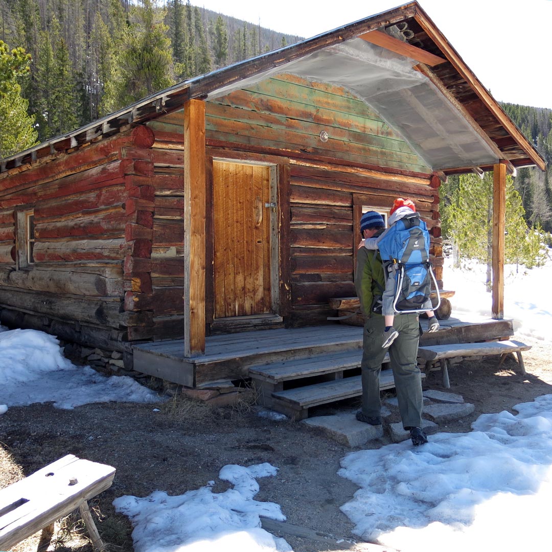 Father and son hiking to the cabin at Holzwarth Historic Site