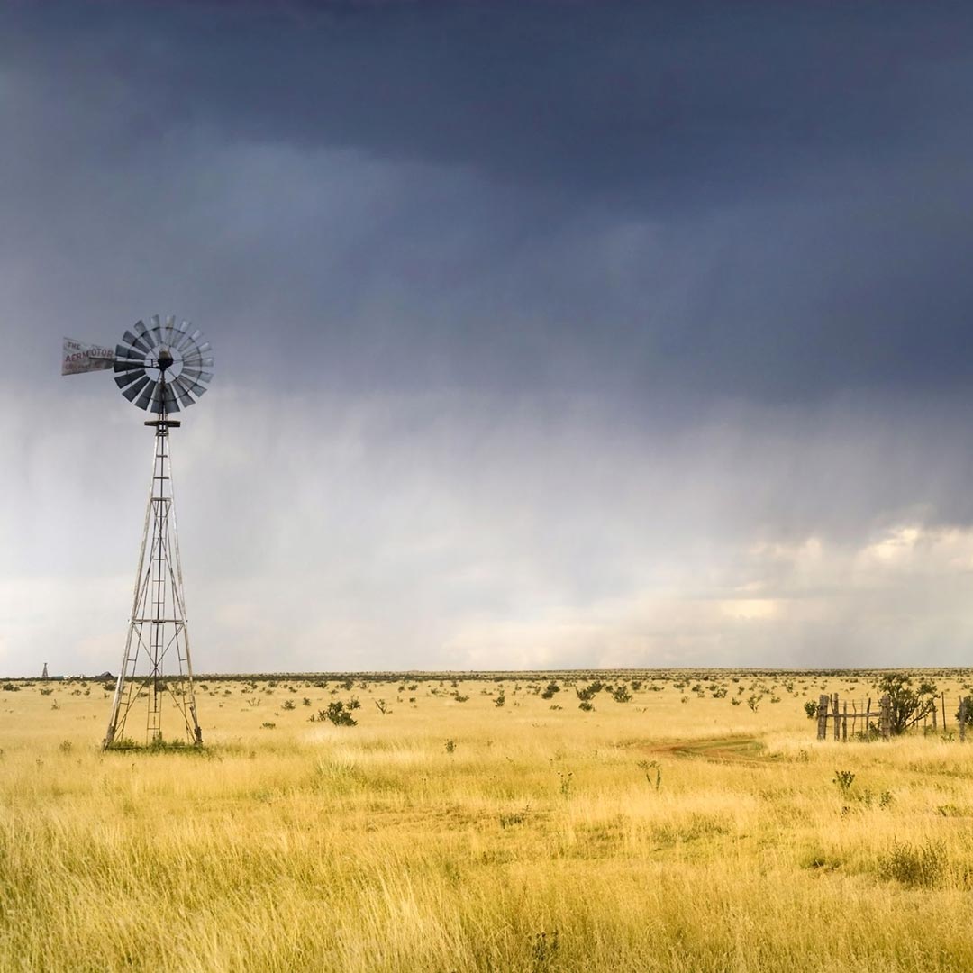 cloudy skies over a windmill and plains in the Texas Panhandle