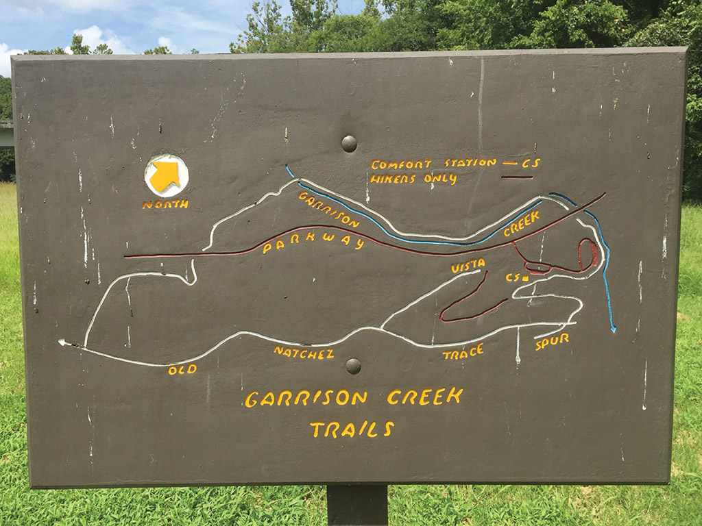 trail map carved into a wooden sign in Garrison Creek Tennessee