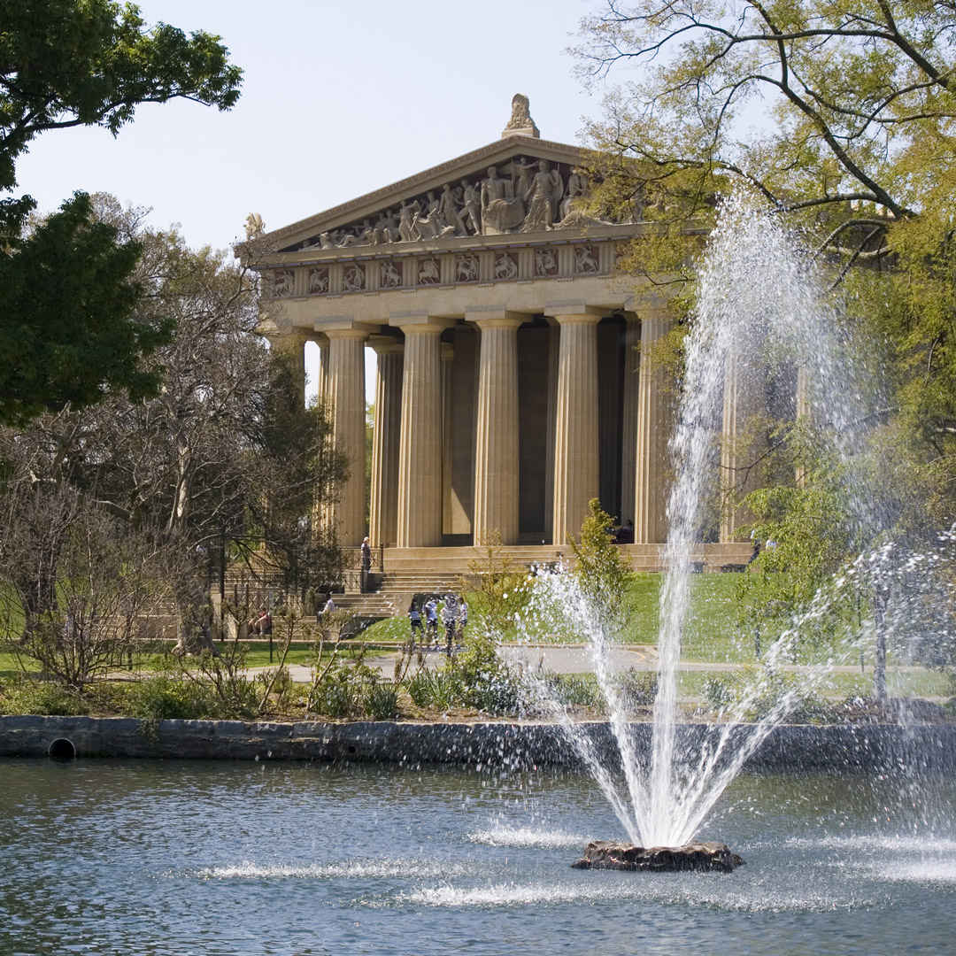 water streams from a fountain in front of the Parthenon in Nashville's Centennial Park