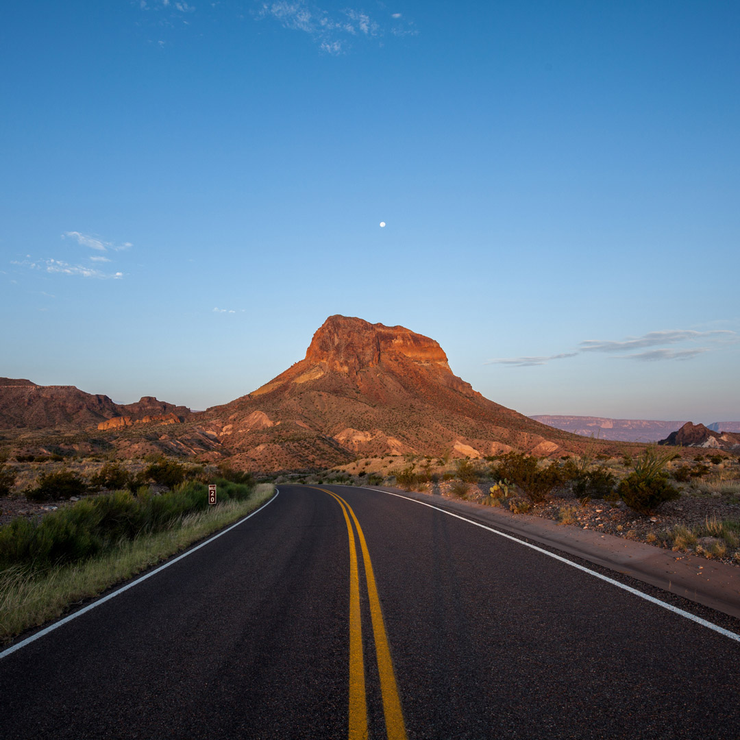 empty road leading to Castellan Peak in the Big Bend Area of Texas