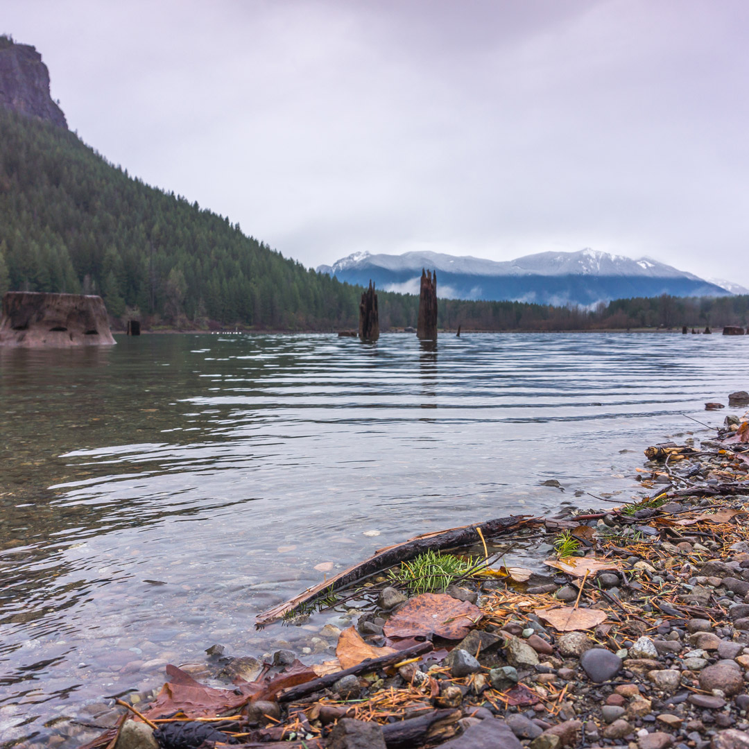 view of Rattlesnake Ledge and mountains from the shore of Rattlesnake Lake