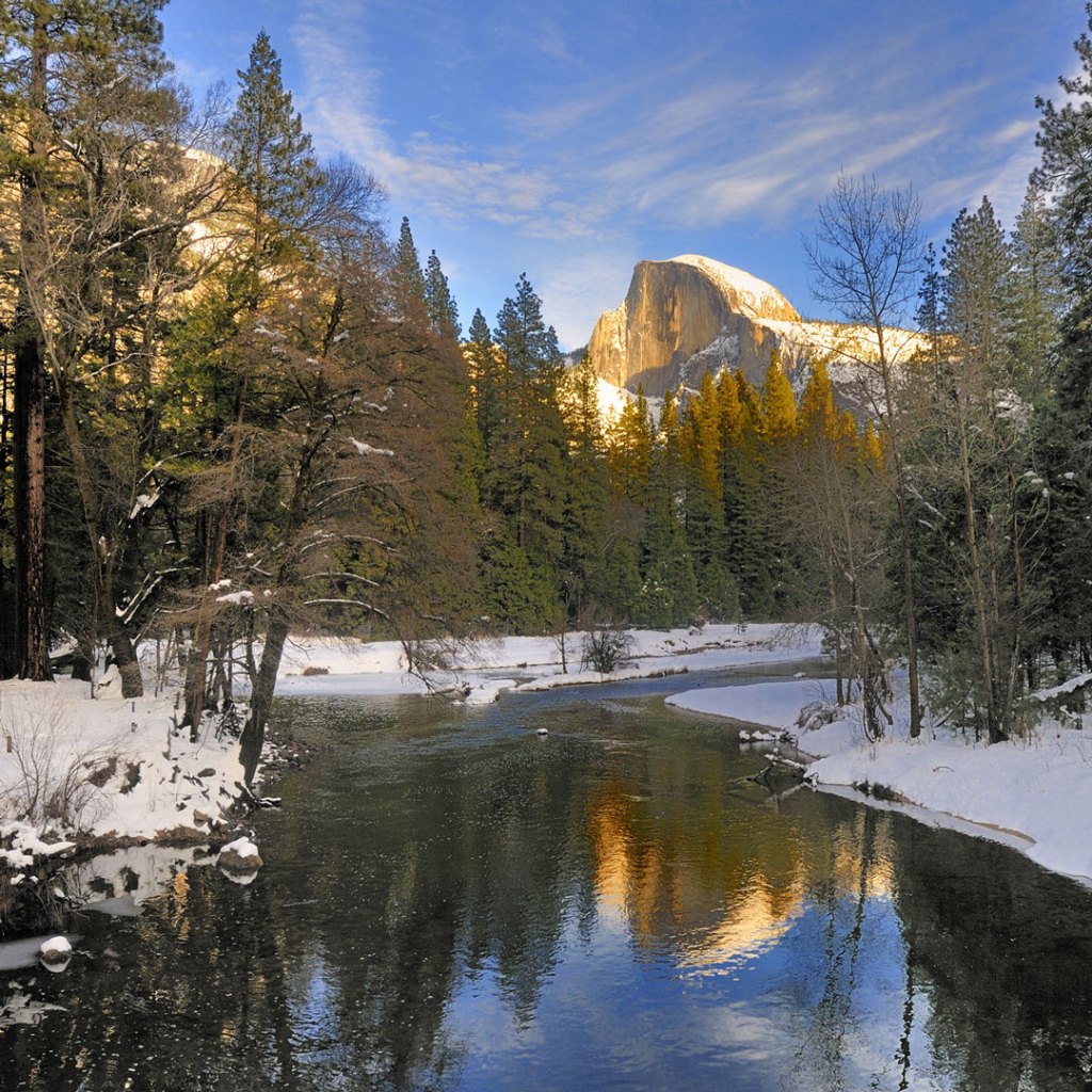 reflection of half dome on the merced river in winter