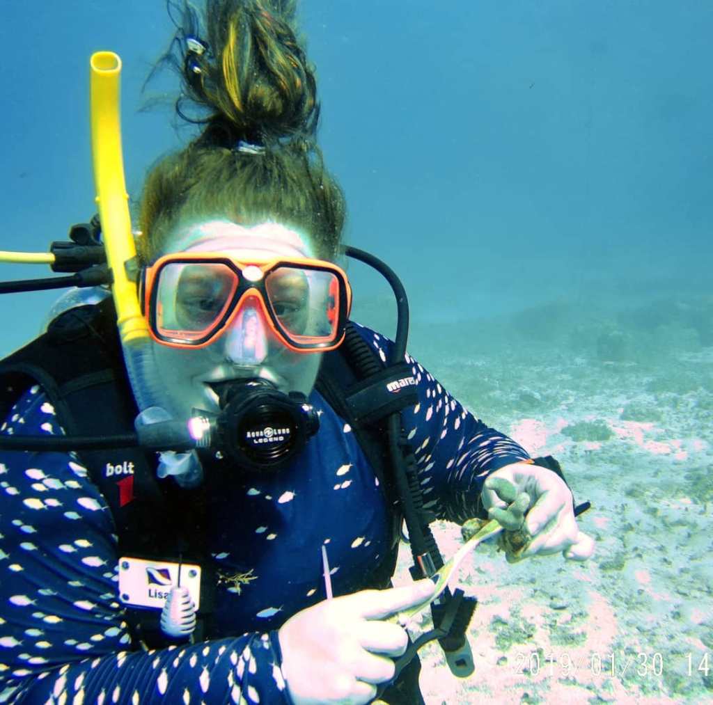 Underwater diving photo of plus size scuba