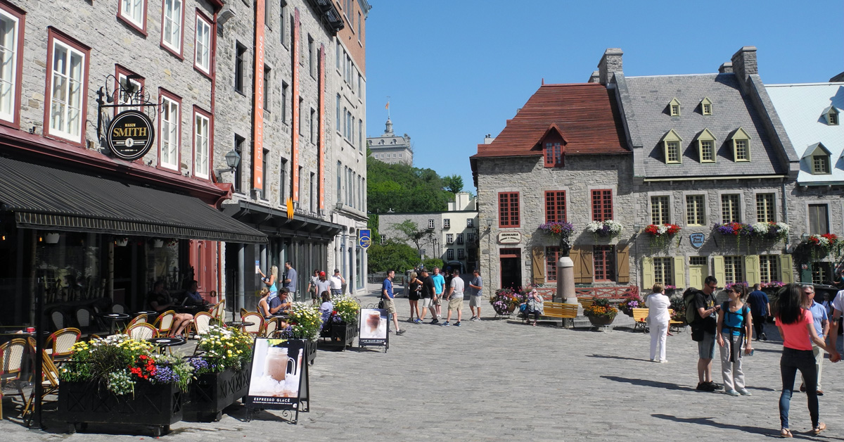 plaza with shops and people milling about