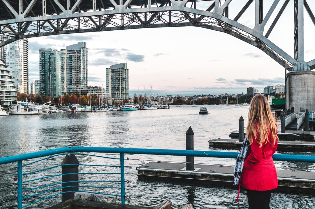 woman gazing out at the False Creek waterway