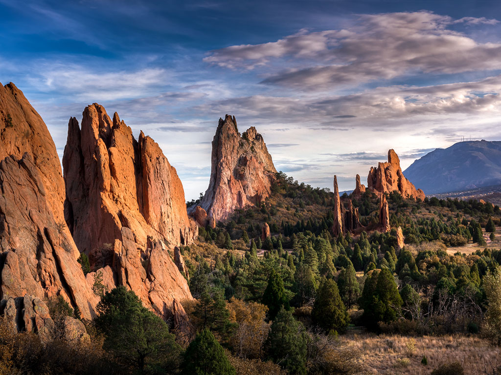 moody blue skies over garden of the gods in colorado