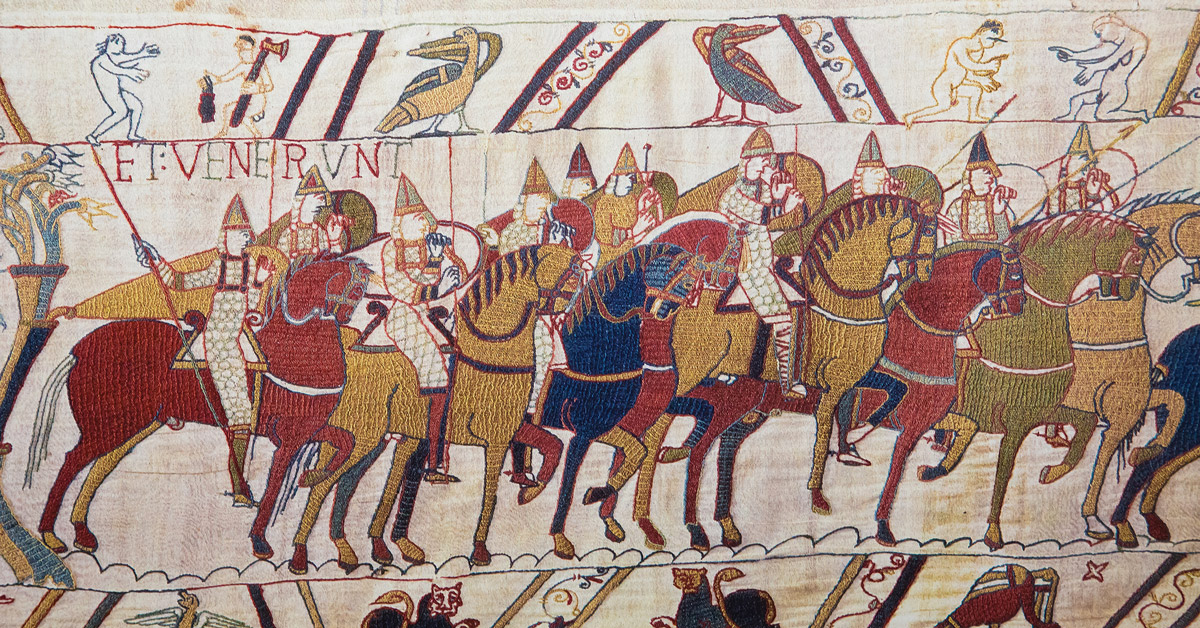embroidered tapestry depicting norman soldiers on horseback
