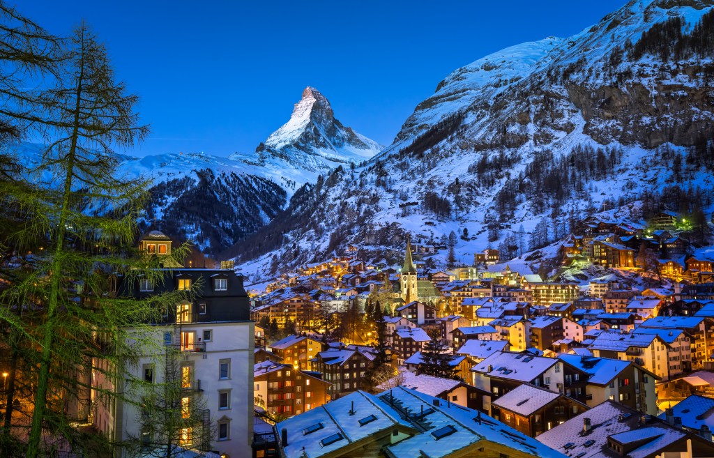 mountain town sitting under the snowy peaks of Matterhorn