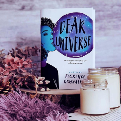 NOVL - Instagram image of book cover for 'Dear Universe' by Florence Gonsalves surrounded by dried eucalyptus and candles