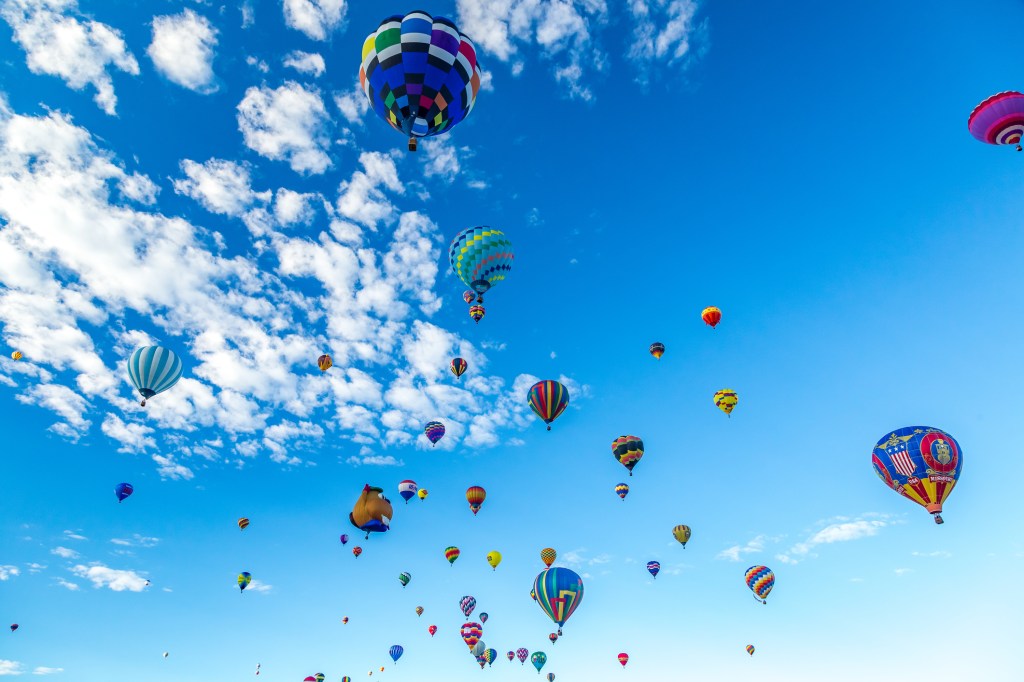 Hot Air Balloons fly over the city of Albuquerque, New Mexico during the mass ascension at the annual International Hot Air Balloon Fiesta in October, 2016