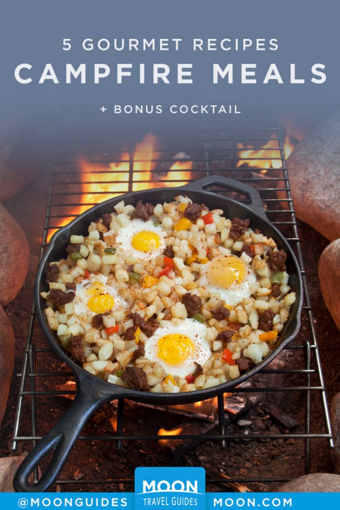 Breakfast hash in a skillet over a campfire. Pinterest Graphic.