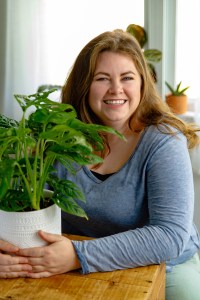 Photo of author Molly Williams holding a potted plant