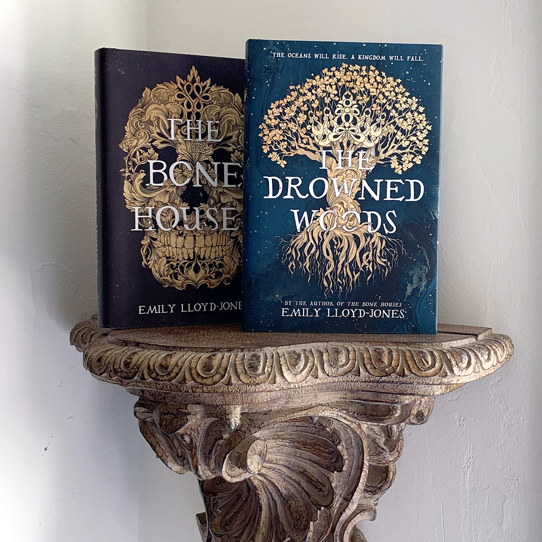 Instagram image of the books "The Bone Houses" and "The Drowned Woods" by Emily Lloyd-Jones